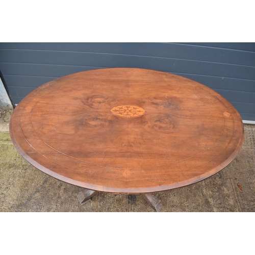 338 - A 19th century walnut tilt-top occasional table with quarter veneered top with inlay decoration on f... 