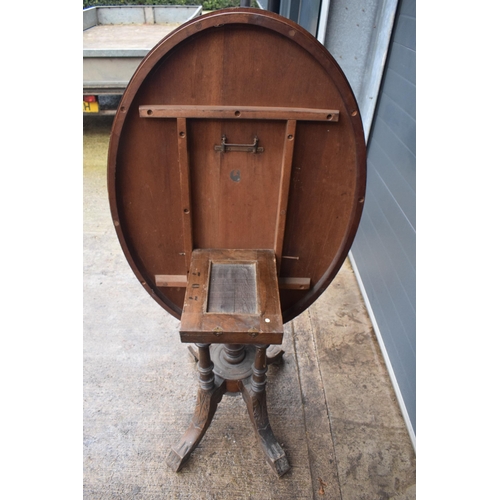 338 - A 19th century walnut tilt-top occasional table with quarter veneered top with inlay decoration on f... 