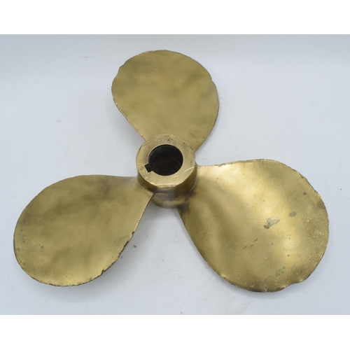 346 - A large and heavy brass three-blade propeller from a boat / ship. 35cm diameter.