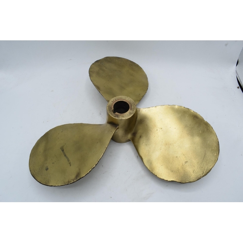 346 - A large and heavy brass three-blade propeller from a boat / ship. 35cm diameter.