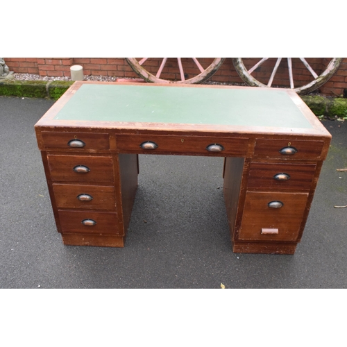 349 - A 20th century knee hole office desk with green leather inset manufactured by Durrant. 137 x 69 x 77... 