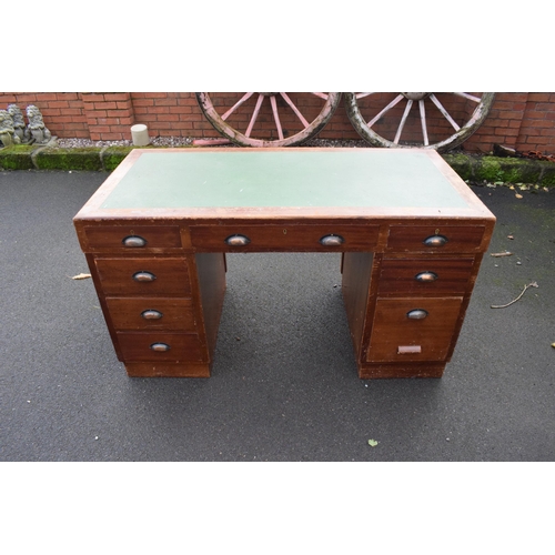 349 - A 20th century knee hole office desk with green leather inset manufactured by Durrant. 137 x 69 x 77... 