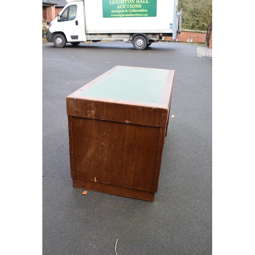 349 - A 20th century knee hole office desk with green leather inset manufactured by Durrant. 137 x 69 x 77... 