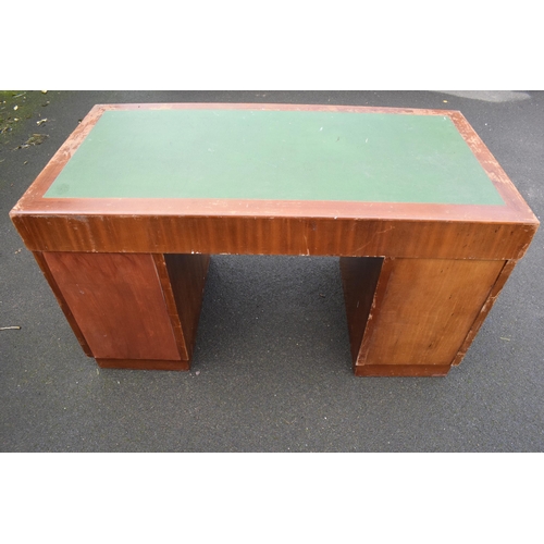 349 - A 20th century knee hole office desk with green leather inset manufactured by Durrant. 137 x 69 x 77... 