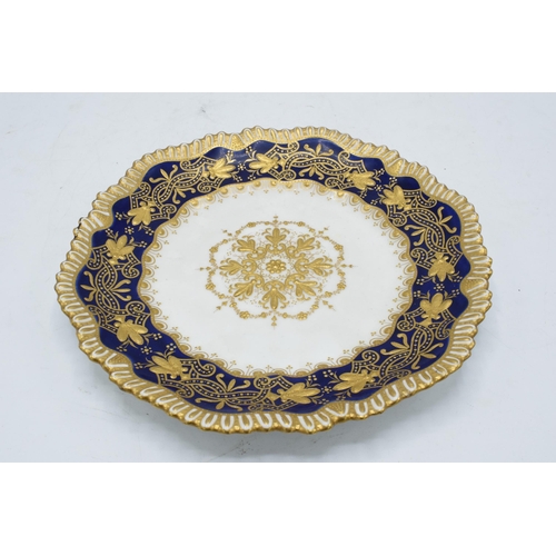 53 - A late 19th / early 20th century heavily gilded shaped-cabinet plate on a cobalt blue background. 21... 