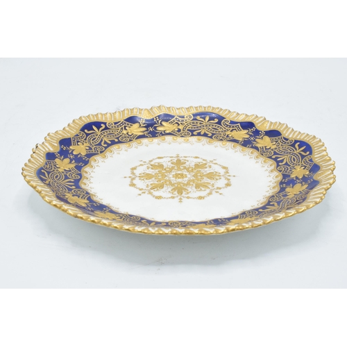 53 - A late 19th / early 20th century heavily gilded shaped-cabinet plate on a cobalt blue background. 21... 