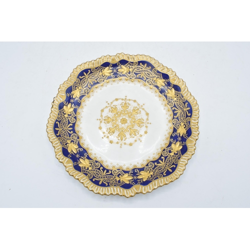 53 - A late 19th / early 20th century heavily gilded shaped-cabinet plate on a cobalt blue background. 21... 