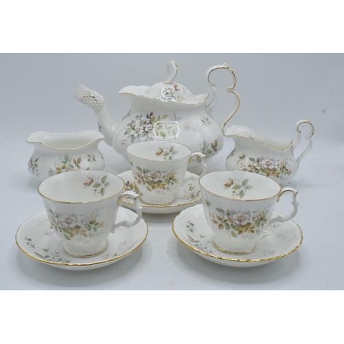 61 - A collection of Royal Albert tea ware in the Haworth design to include a tea pot, 12 cups and saucer... 