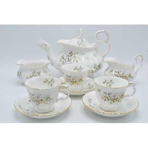 61 - A collection of Royal Albert tea ware in the Haworth design to include a tea pot, 12 cups and saucer... 