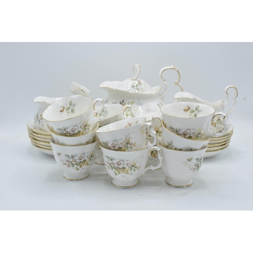 61 - A collection of Royal Albert tea ware in the Haworth design to include a tea pot, 12 cups and saucer... 