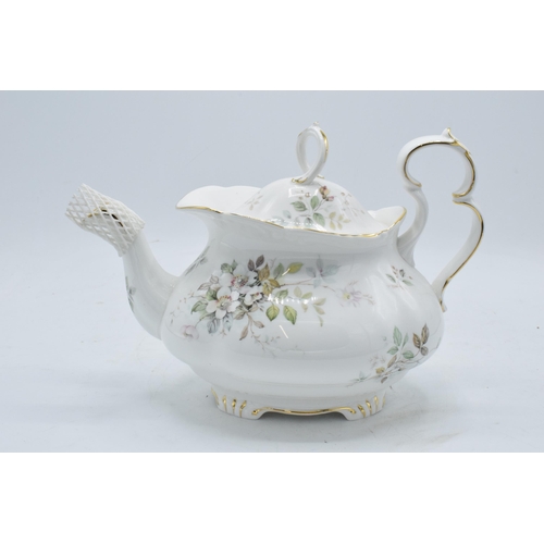 61 - A collection of Royal Albert tea ware in the Haworth design to include a tea pot, 12 cups and saucer... 