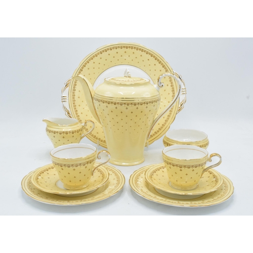 68 - Aynsley coffee set in a yellow and gold design to consist of a coffee pot, milk and sugar pot, 5 cof... 