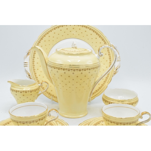 68 - Aynsley coffee set in a yellow and gold design to consist of a coffee pot, milk and sugar pot, 5 cof... 