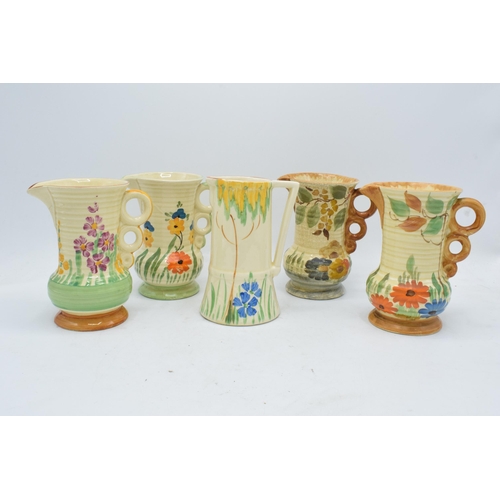 82 - A collection of Wade Heath Art Deco jugs all with floral decorations (5). 13.5cm tall. Generally in ... 