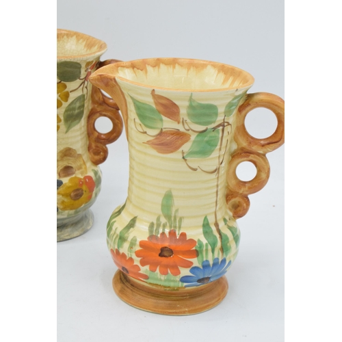 82 - A collection of Wade Heath Art Deco jugs all with floral decorations (5). 13.5cm tall. Generally in ... 