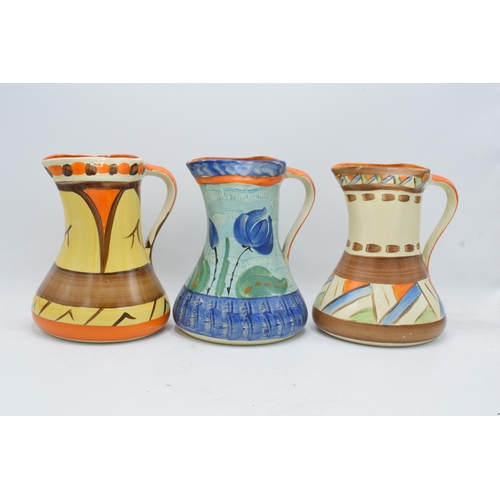 86 - A collection of Myott Son and Co Art Deco jugs depicting various designs (3). 19cm tall. Generally i... 