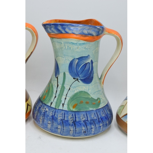 86 - A collection of Myott Son and Co Art Deco jugs depicting various designs (3). 19cm tall. Generally i... 