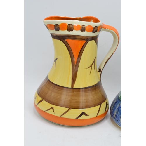 86 - A collection of Myott Son and Co Art Deco jugs depicting various designs (3). 19cm tall. Generally i... 