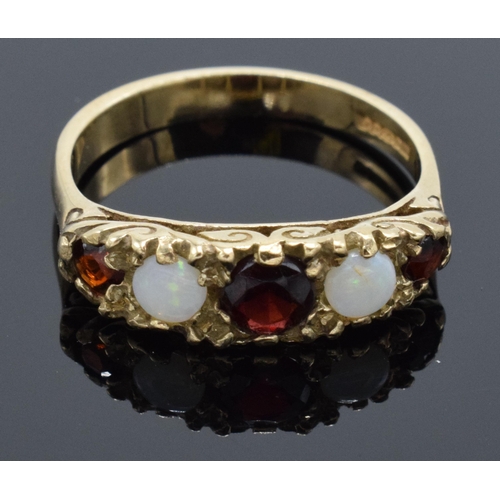 230H - 9ct gold ladies ring set with opal and garnet stones. 2.9 grams. Size O.