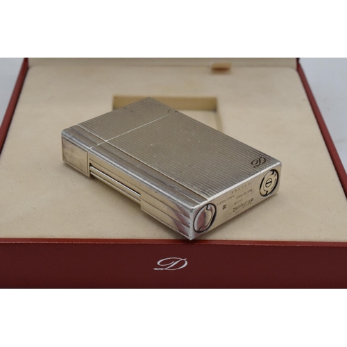 234A - A boxed silver plated ST Dupont lighter