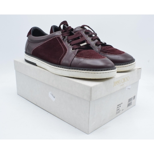 235B - A pair of Jimmy Choo Miami burgundy suede and patent leather men's trainers, with a think sole, leat... 