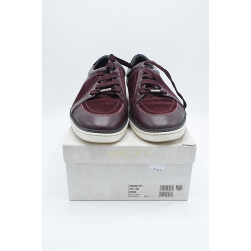 235B - A pair of Jimmy Choo Miami burgundy suede and patent leather men's trainers, with a think sole, leat... 