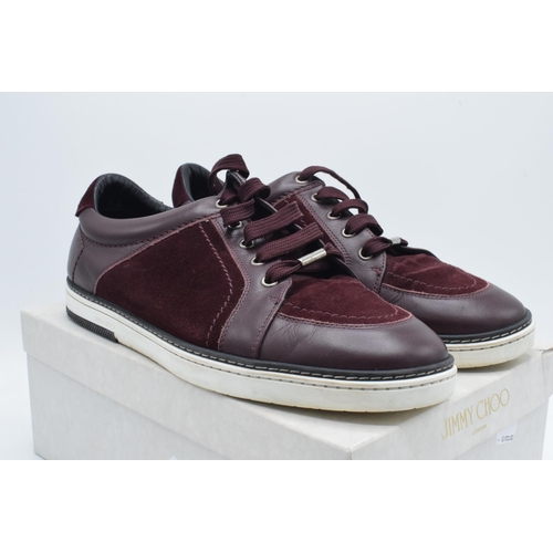 235B - A pair of Jimmy Choo Miami burgundy suede and patent leather men's trainers, with a think sole, leat... 