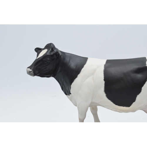 160B - Royal Doulton (Beswick) matte Connoisseur model of a Friesian Cow mounted on a wooden base. In good ... 