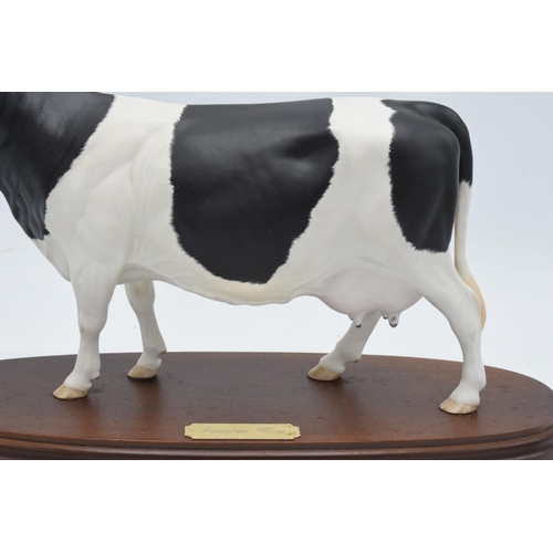 160B - Royal Doulton (Beswick) matte Connoisseur model of a Friesian Cow mounted on a wooden base. In good ... 