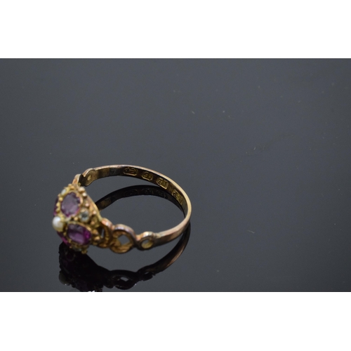 203F - Victorian 12ct gold ladies ring set with a seed pearl and amethyst stones. 1.7 grams. UK size O.