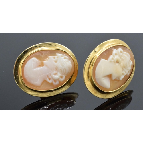 203L - Pair of cameo set earrings in gold coloured metal, testing as 18ct gold, and marked 18kt