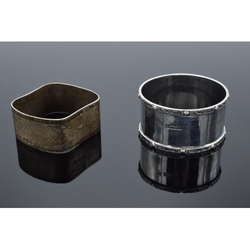 205 - A pair of silver napkin rings, one circular Birmingham 1954 and a square example Birmingham 1928. 42... 