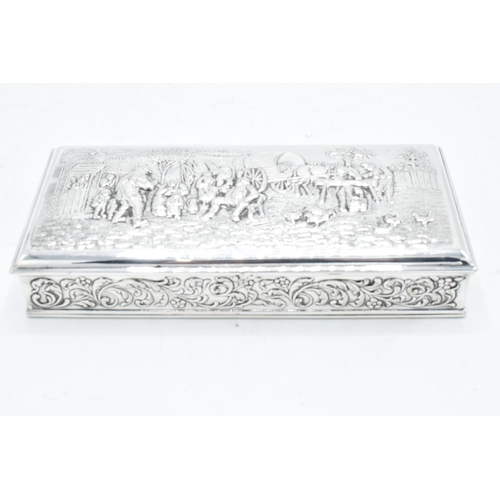 217 - Dutch silver cigarette box with repoussé decoration of a tavern scene. 18 x 8cm.