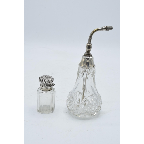 222 - A silver topped scent bottle with a stopper (Birmingham 1910) together with a sterling silver topped... 