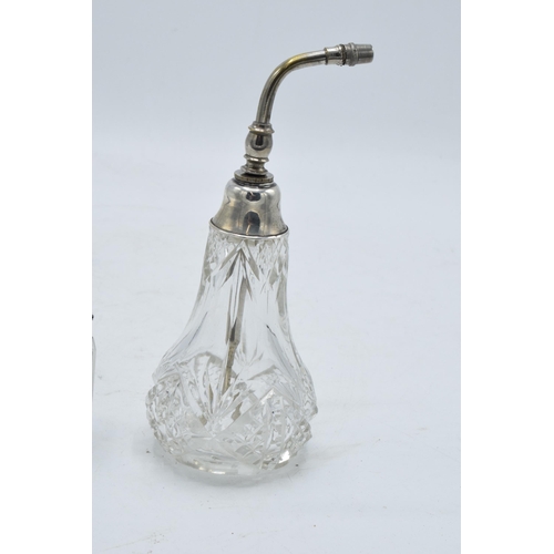 222 - A silver topped scent bottle with a stopper (Birmingham 1910) together with a sterling silver topped... 