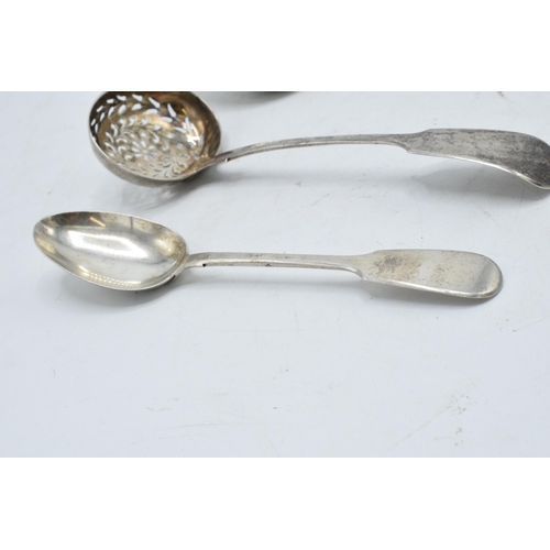 227 - A collection of silver to include a Victorian sifter spoon Edinburgh, a tea spoon and a dessert spoo... 