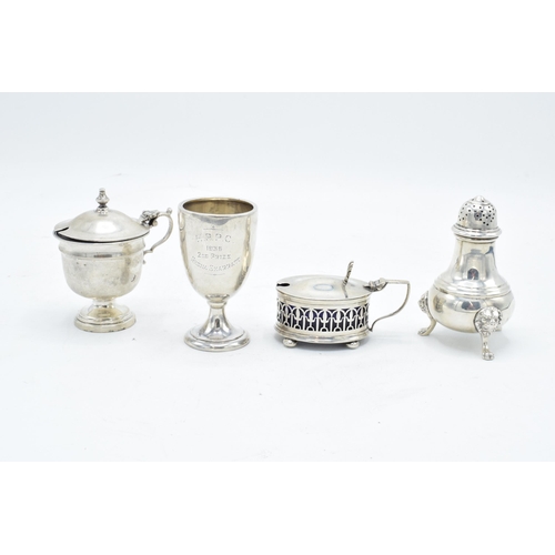 232 - A collection of silver to include matched cruets and a small beaker (4). 181.9 grams of silver.