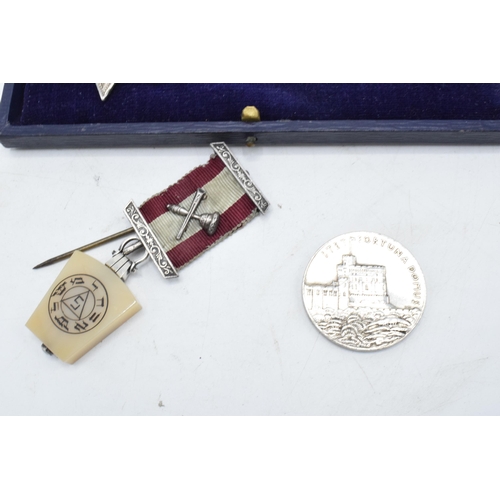 238 - A cased silver attendance medal together with a George V commemorative coin and a Masonic type jewel... 