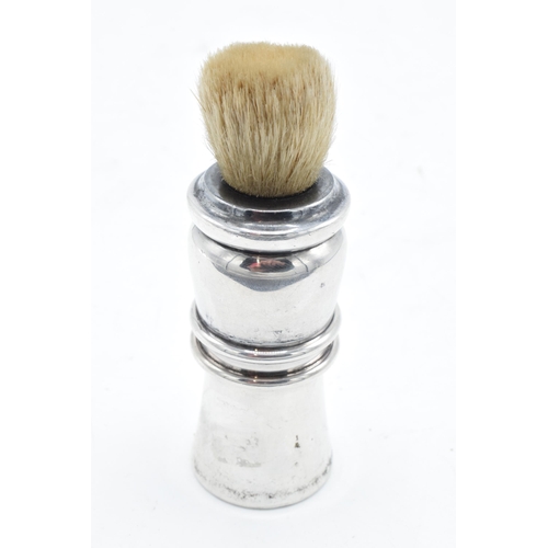 239 - Silver shaving brush. London 1927. 10.5cm tall.