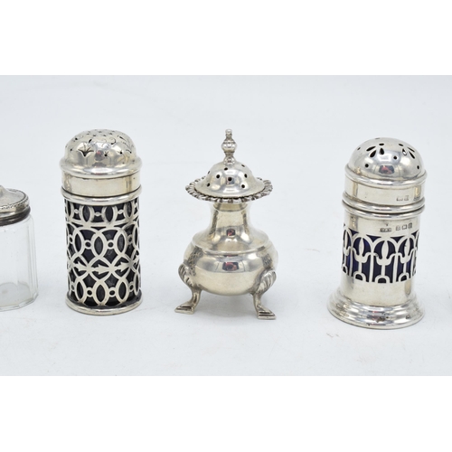 243 - A collection of silver cruets and a near pair of sterling silver topped glass cruets (5).