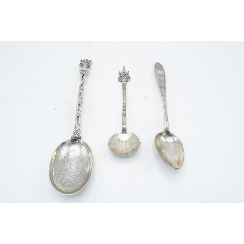 245 - A collection of spoons to include a Paul Orr Madras Indian silver serving spoon, Selangor preserve s... 