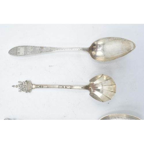 245 - A collection of spoons to include a Paul Orr Madras Indian silver serving spoon, Selangor preserve s... 