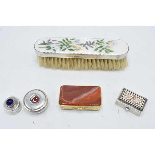 246 - A collection of silver items to include a Guilloche enamel hand brush with silver mount, a gilt meta... 