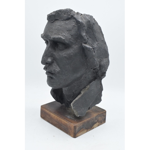 253 - A 20th century studio-made bust of a gentleman mounted on a wooden base. 34m tall.