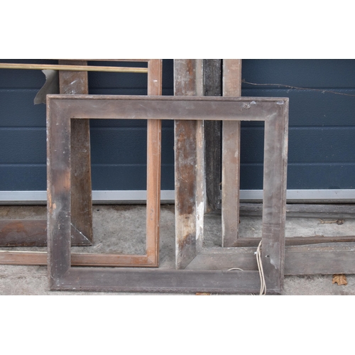 288 - A collection of various shaped oak and similar hardwood picture frames with the largest being 92 x 7... 