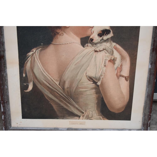 292 - A framed antique print of a dressed lady holding a dog 'Lucky Dog' 74 x 57cm inc frame.