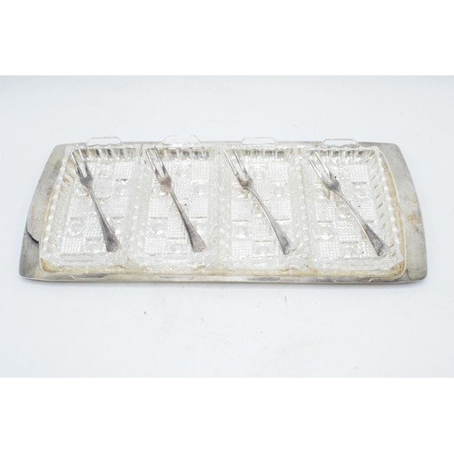 312 - Silver plated 4 section glass hors d'oeuvres tray with 4 matching forks. 39cm long.