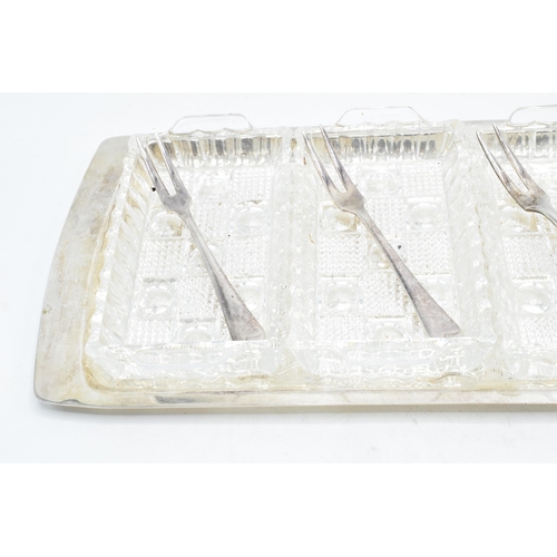 312 - Silver plated 4 section glass hors d'oeuvres tray with 4 matching forks. 39cm long.