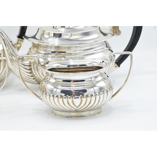 314 - Silver plated 4-piece tea set with ribbed decoration to include tea pot, coffee pot, milk and sugar ... 