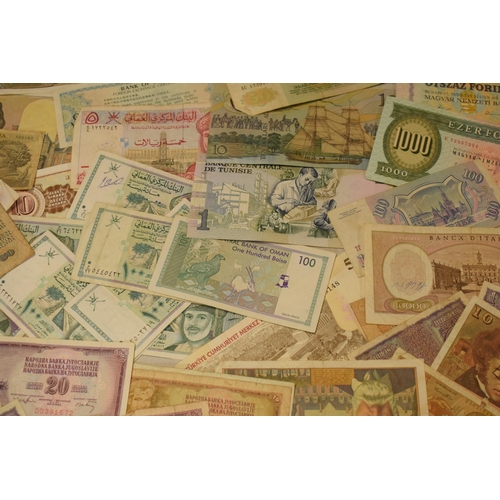 317 - A mixed collection of bank notes from across the world to include examples from Singapore, Ghana, Fr... 